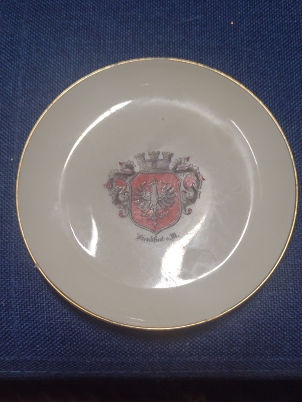 Cream and Gold Accent Decorative Plate with Heraldic Crest